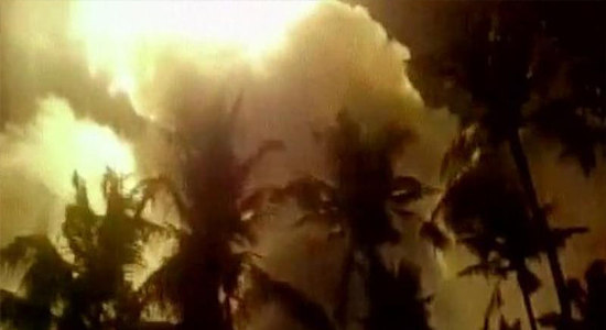 The smoke rises as the fire goes out of control